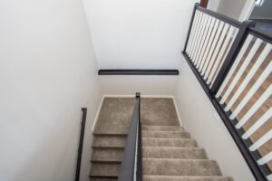 stairs with wooden railing